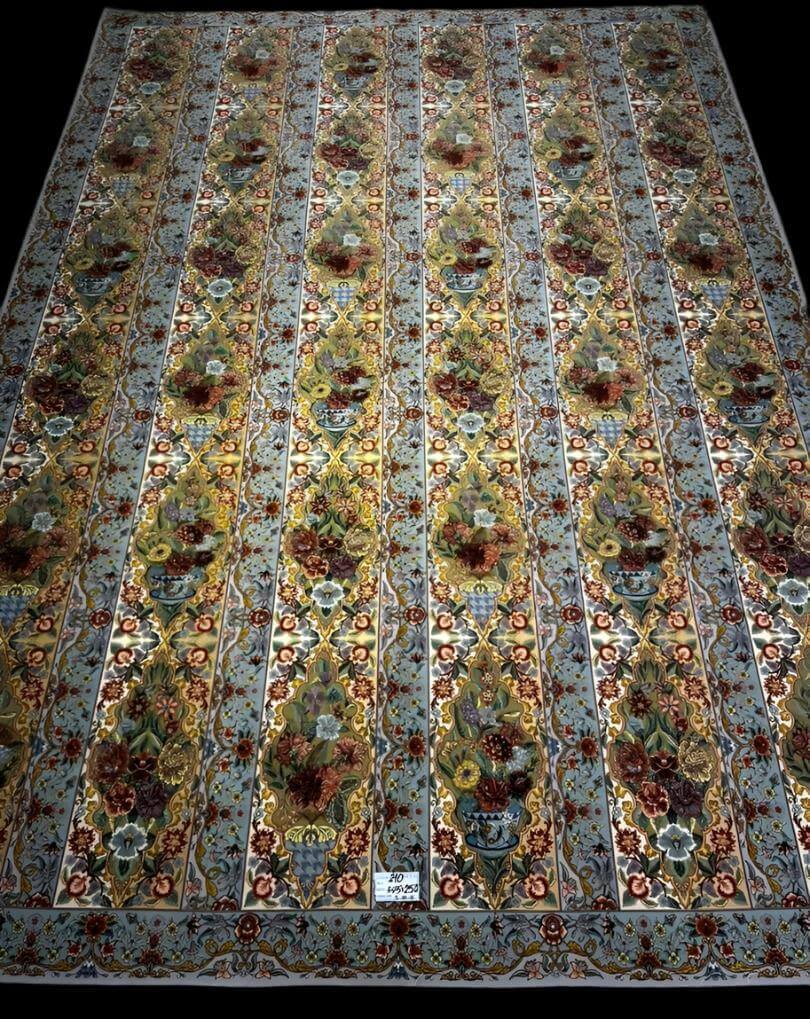 "High-density knotted Persian carpet from Iran, with vibrant floral designs and luxurious silk warp."